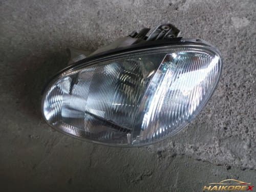 Фара передняя левая (водителя) Hyundai Sonata EF 9210138201 с прозрачным сигналом