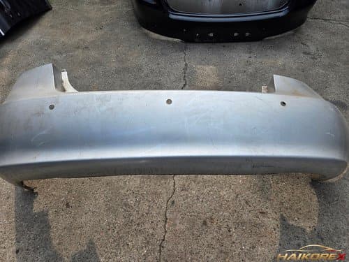 Накладка заднего бампера Hyundai Elantra HD 866102H000 (под 3 датчика) старый образец 2006-2010 B-класс (деформирована)