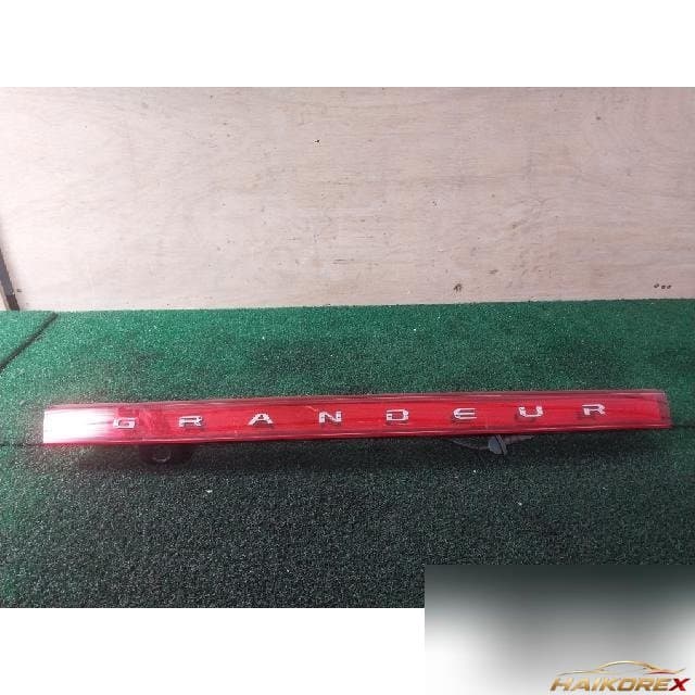 Hyundai Grandeur TG 2008 — накладка крышки багажника левая (с фонарём подсветки номера) 87360-3L020