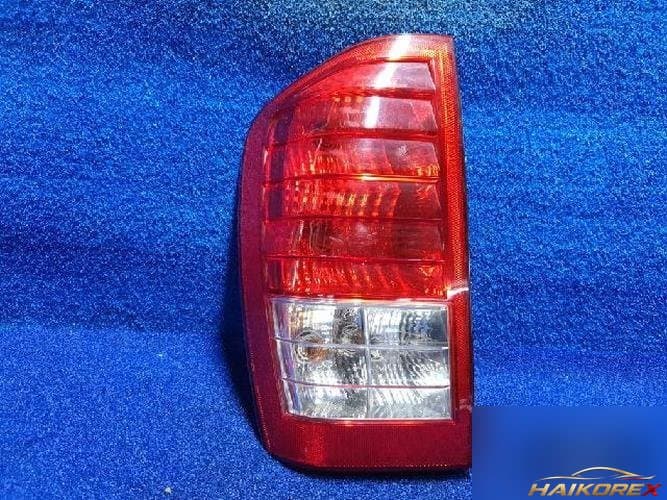 Kia Carnival 2010 — фонарь задний левый наружный 3