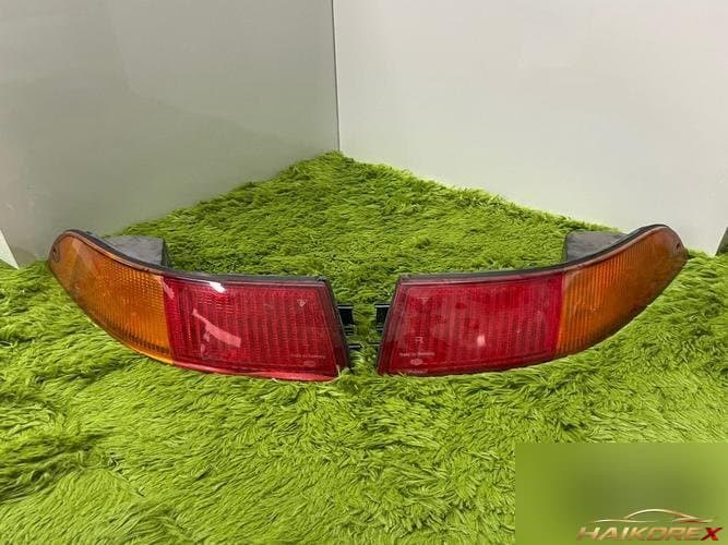 Porsche 911 1990 — фонарь задний левый наружный 99363140300