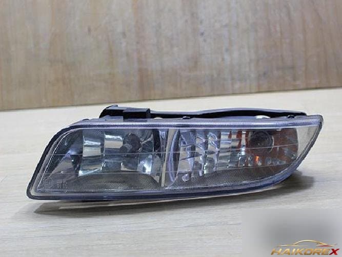 KG Mobility Rexton 2002 — противотуманная фара левая (водительская)