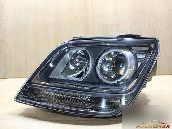 Kia Mohave 2008 — фара левая HID 1