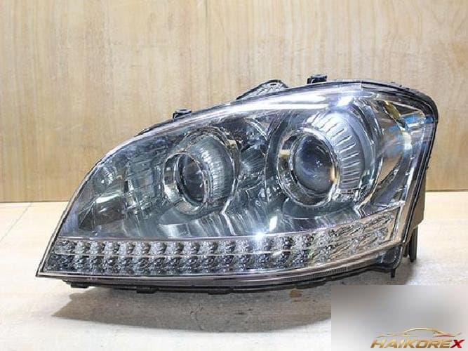 KG Mobility Chairman 2009 — фара левая HID