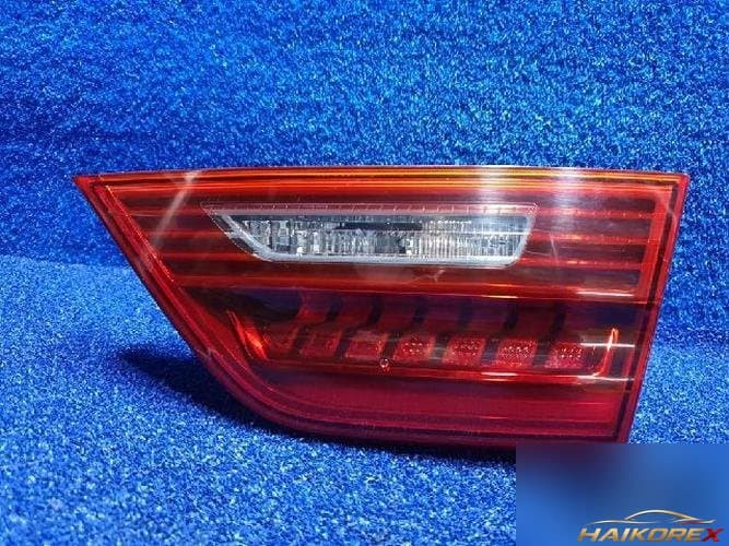 Kia K7 2016 — накладка крышки багажника с фонарём подсветки номера 92404F6