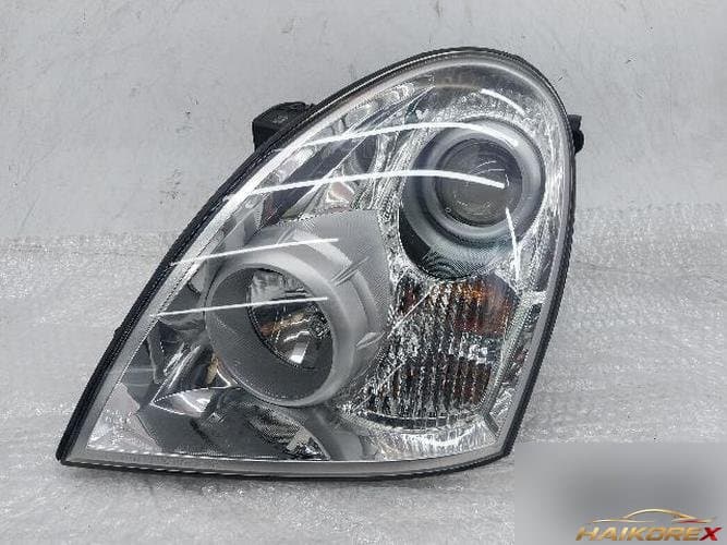 KG Mobility Rexton 2008 — фара левая (2)