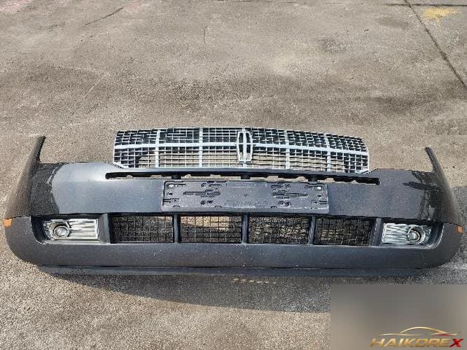 Ford MKX 2008 — передний бампер с противотуманками и решёткой