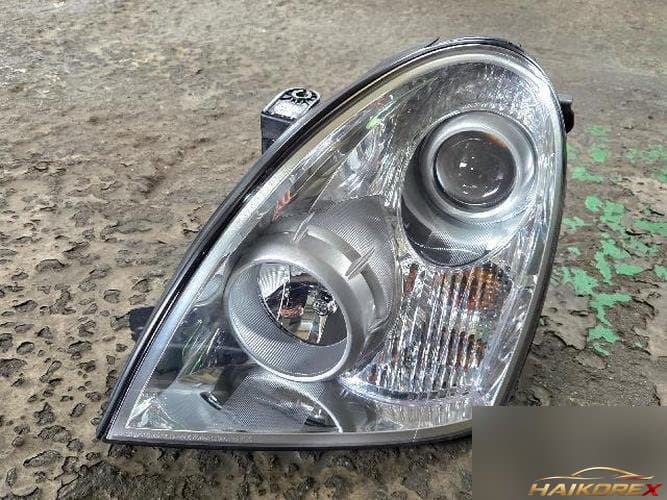 KG Mobility Rexton 2011 — фара передняя левая